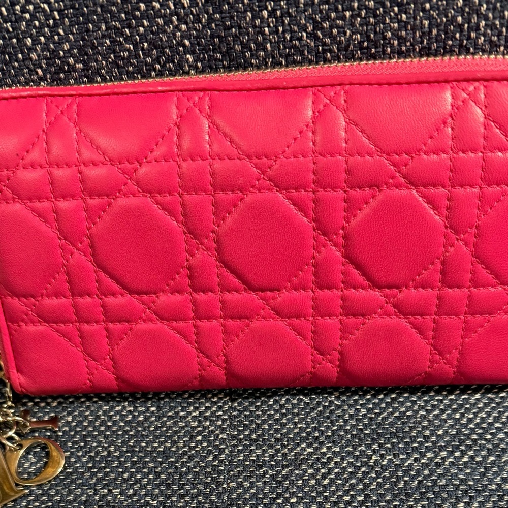 CHRISTIAN DIOR PINK LEATHER CANNAGE ZIPPY WALLET WITH SILVER CHARMS. EUC.